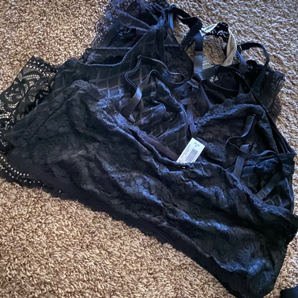 Torrid - bundle of lace bralettes with tags.